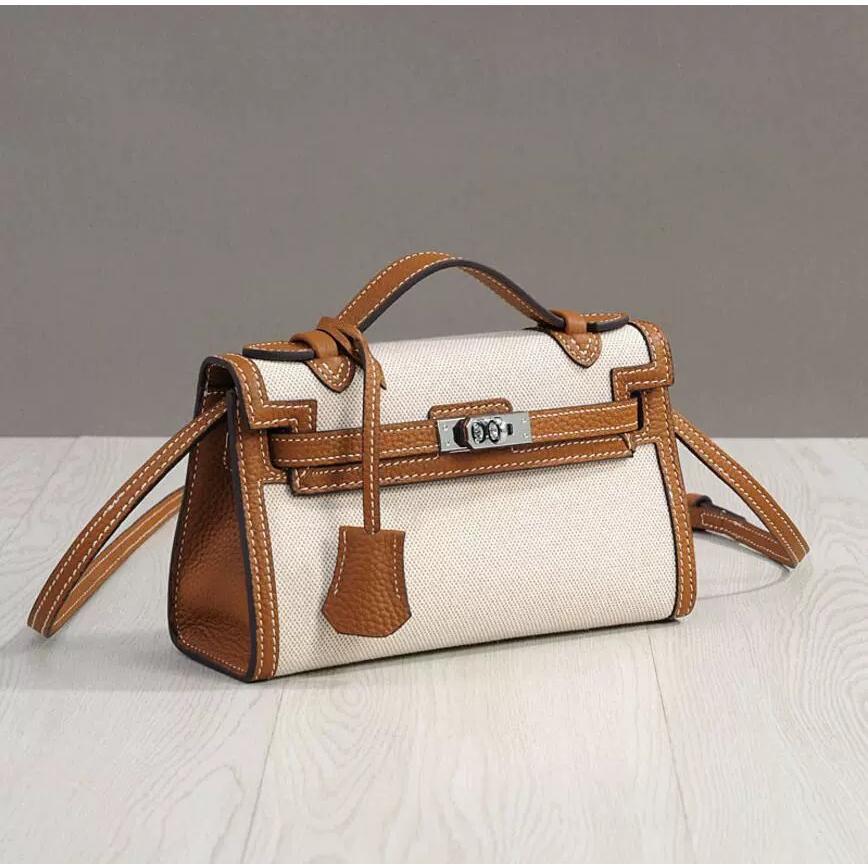 2025 new canvas generation Kelly bag fashion shoulder crossbody portable small square bag casual lock leather women's bag